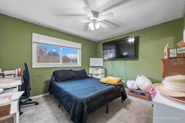 bedroom featuring ceiling fan and light colored carpet