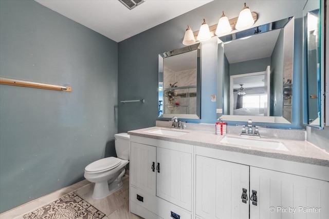 bathroom with tile patterned flooring, vanity, toilet, and an enclosed shower