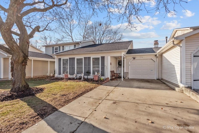 view of front of home with a front yard, a garage, and a sunroom