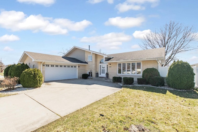 view of front of property with cooling unit, a garage, and a front yard