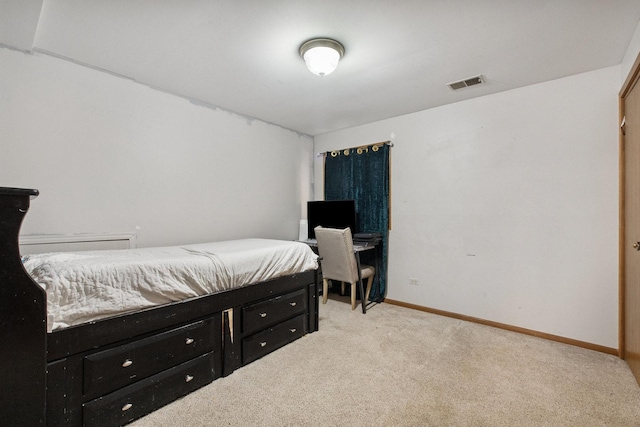 bedroom with light colored carpet