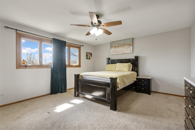 bedroom featuring ceiling fan and light colored carpet