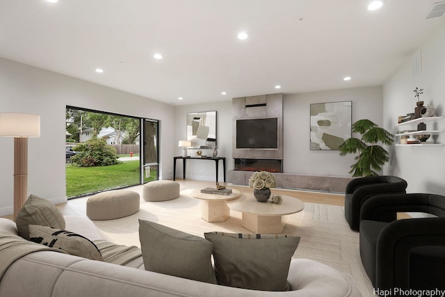 living room with light hardwood / wood-style flooring