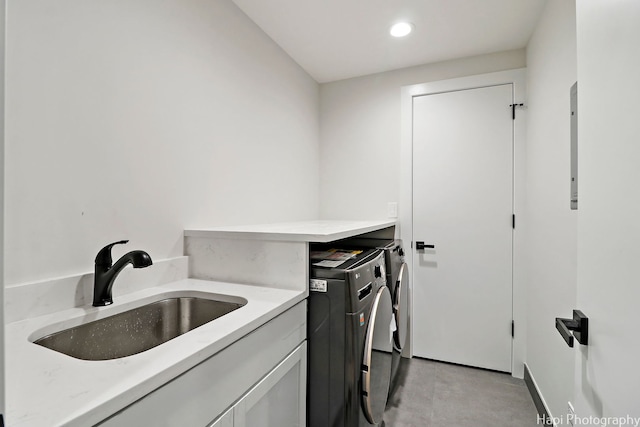 laundry area featuring washer and dryer and sink