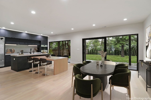 dining area with light wood-type flooring