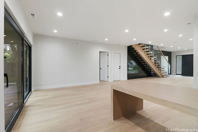 interior space featuring light wood-type flooring and a wealth of natural light