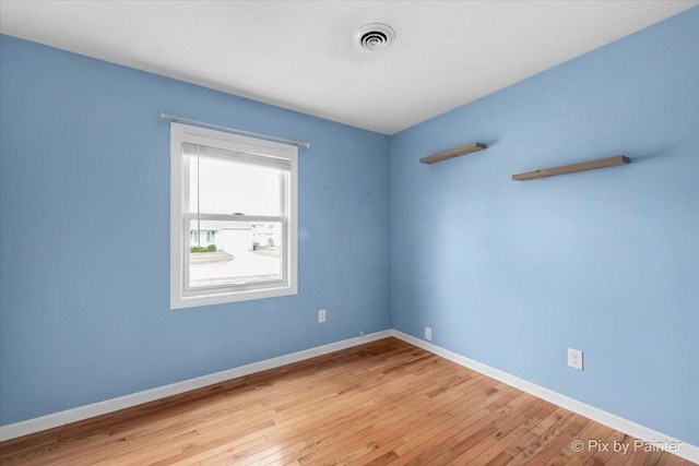 empty room with light hardwood / wood-style floors