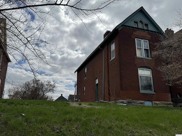 view of property exterior featuring a yard