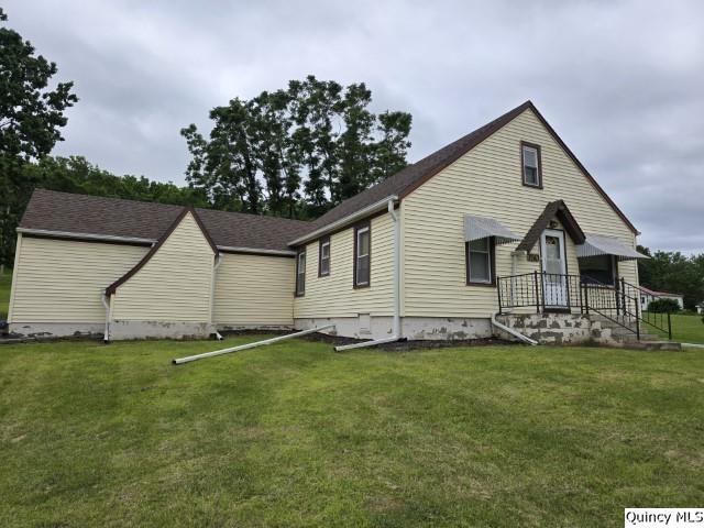 exterior space featuring a front lawn