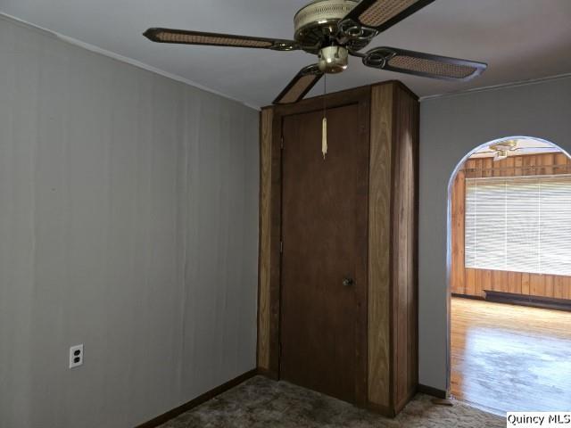 unfurnished bedroom featuring a closet and ceiling fan