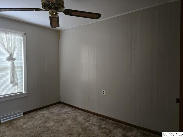 unfurnished room featuring ceiling fan