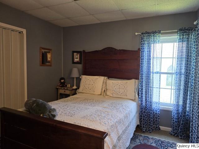 bedroom featuring a paneled ceiling