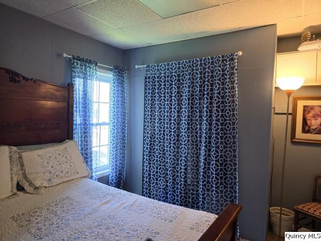 bedroom featuring a paneled ceiling