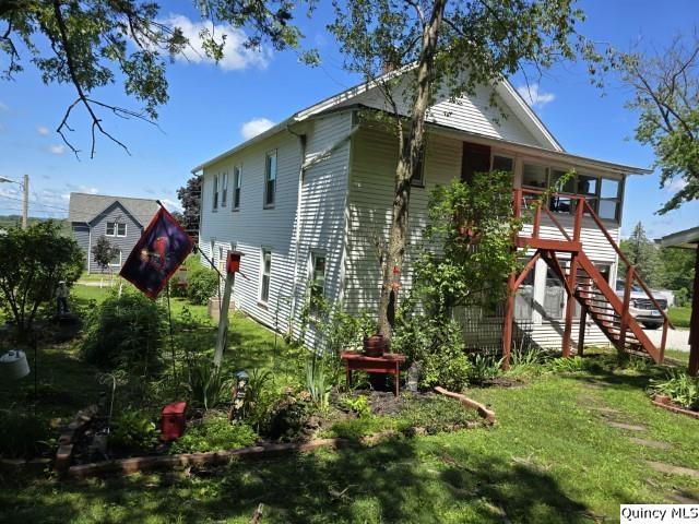 view of home's exterior with a lawn