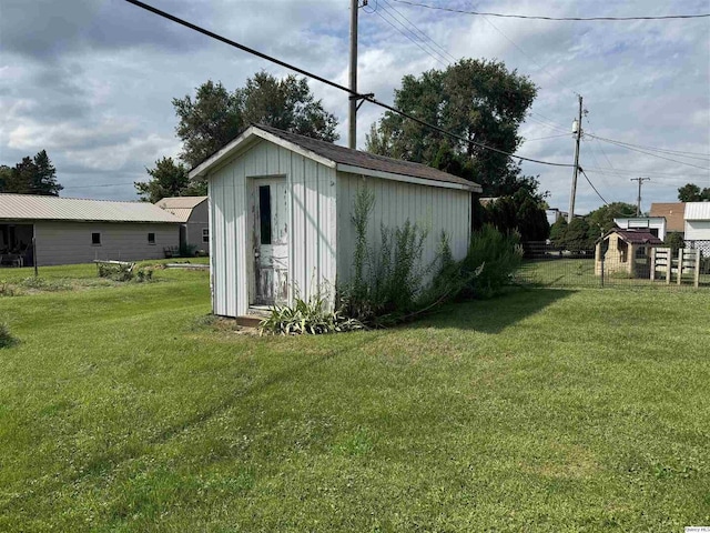 view of outbuilding featuring a yard