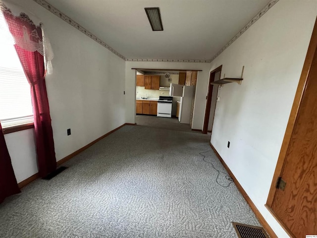 unfurnished living room with carpet floors