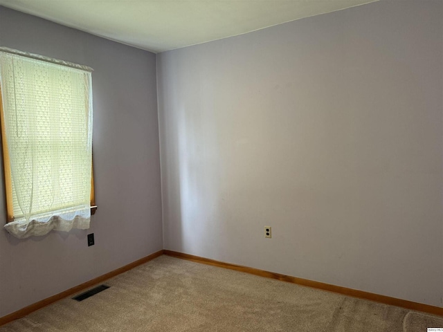 view of carpeted spare room