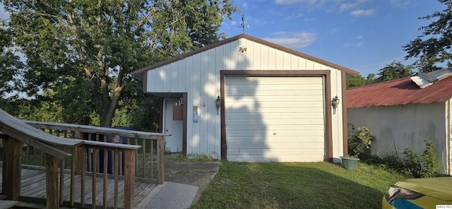 garage featuring a yard