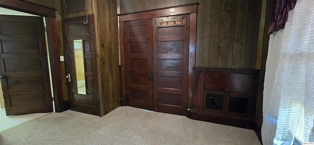 interior space featuring wooden walls