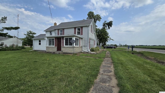 view of front facade with a front yard