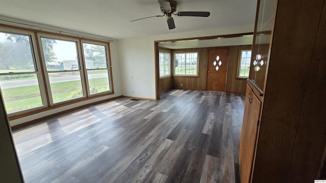 interior space featuring ceiling fan and dark hardwood / wood-style flooring