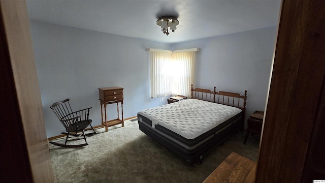 bedroom with dark colored carpet