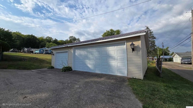 garage featuring a yard