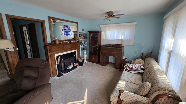 carpeted living room featuring ceiling fan