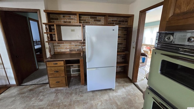 kitchen with white refrigerator and wall oven