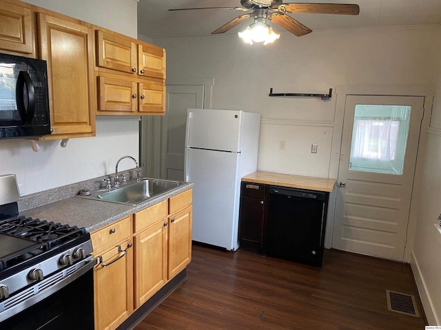 kitchen featuring ceiling fan, dark hardwood / wood-style floors, sink, and black appliances