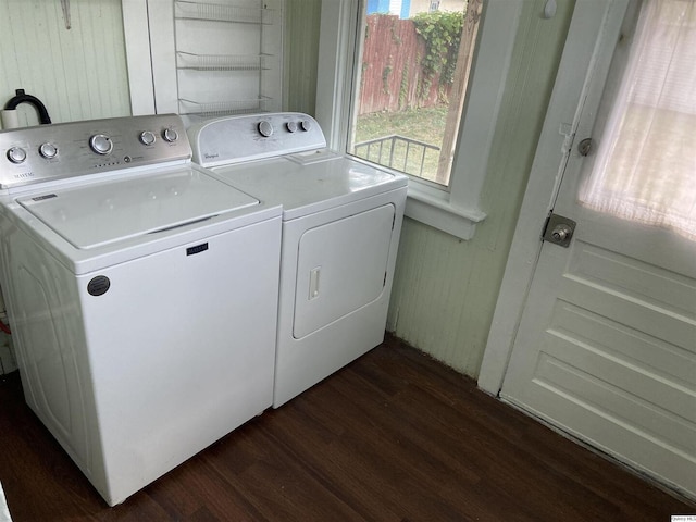 laundry room featuring dark wood-type flooring and washing machine and dryer