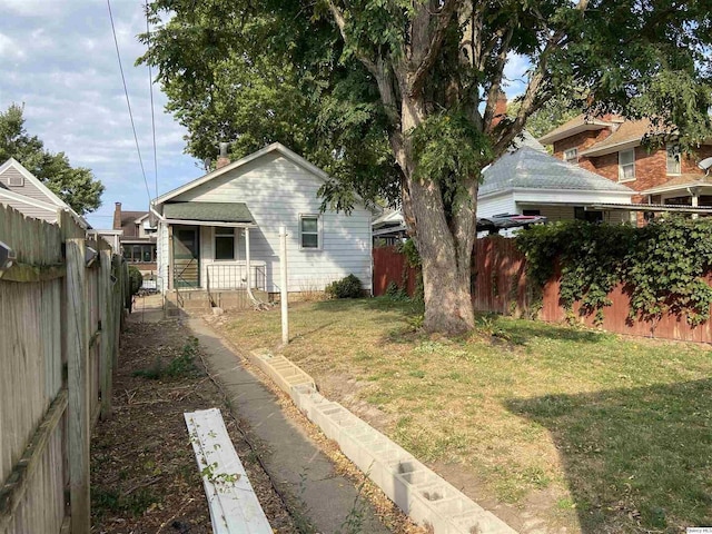 view of property exterior featuring a lawn