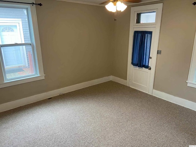 unfurnished room featuring carpet floors and ceiling fan