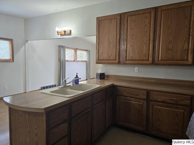 kitchen featuring sink and kitchen peninsula