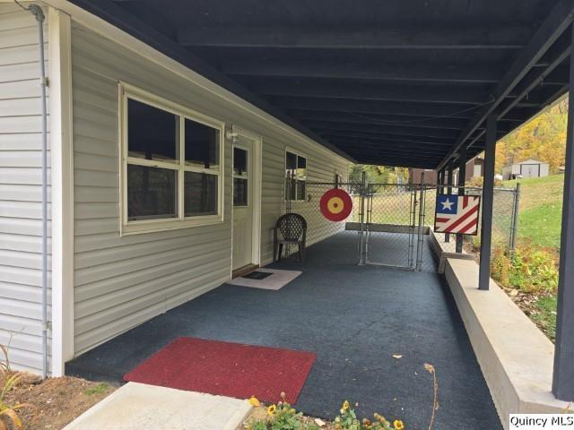 view of patio / terrace featuring a carport