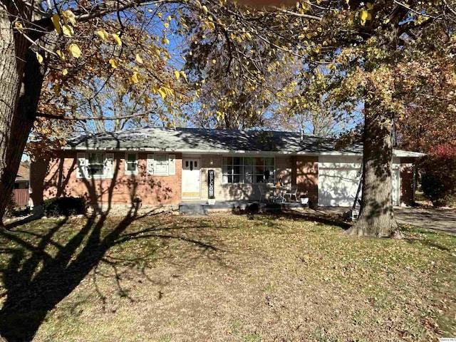 rear view of property featuring a yard