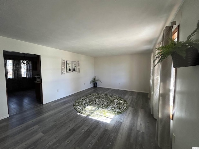 empty room with dark wood-type flooring