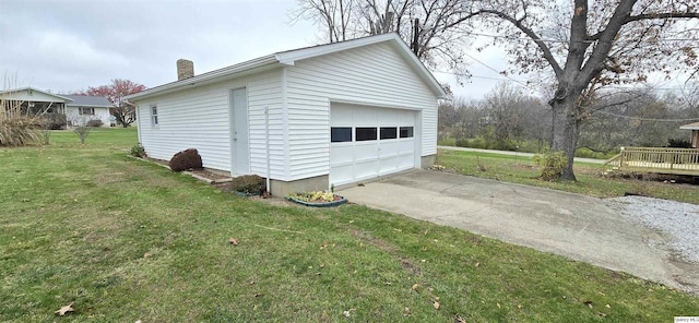 garage featuring a lawn