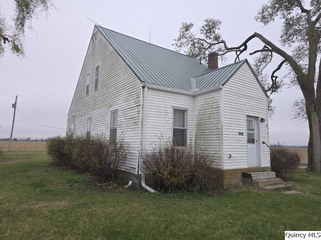 exterior space featuring a front lawn