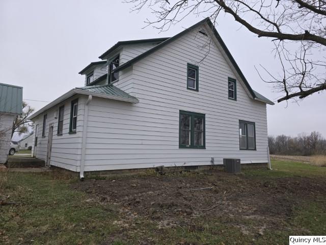 back of property with cooling unit