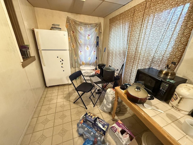 dining space featuring light tile patterned floors