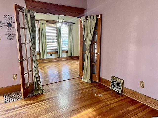 spare room featuring hardwood / wood-style floors