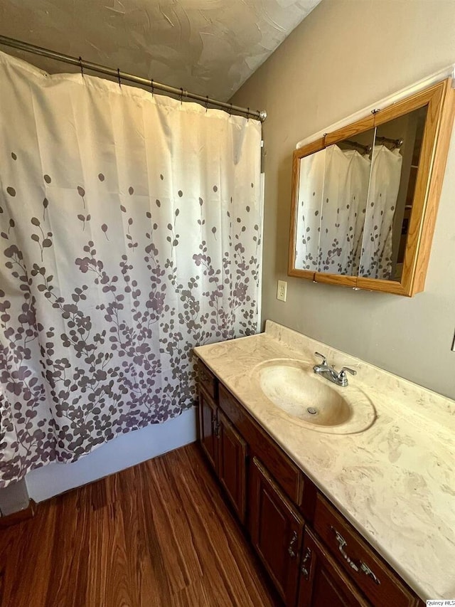 bathroom featuring vanity and hardwood / wood-style flooring