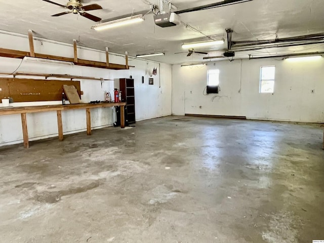 garage featuring a garage door opener and a workshop area