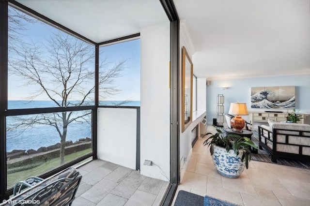 sunroom / solarium with a water view