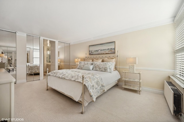 bedroom with light carpet, radiator, crown molding, and multiple windows