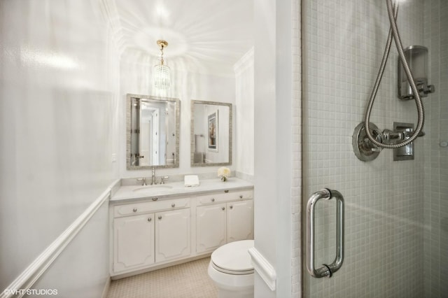 bathroom with walk in shower, toilet, ornamental molding, vanity, and tile patterned flooring