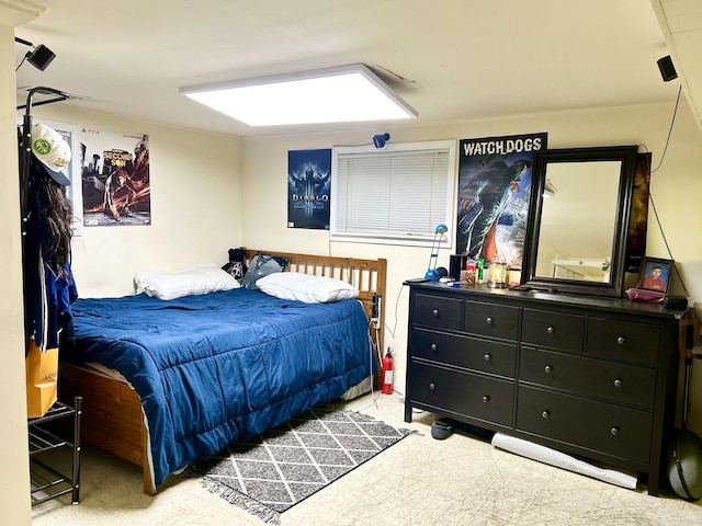 bedroom featuring light carpet