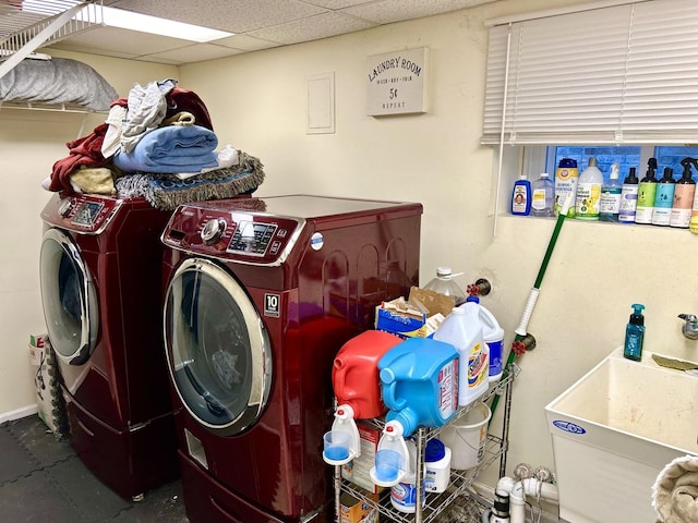 laundry area featuring washer and clothes dryer and sink