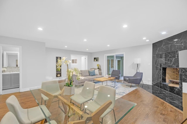 living room with a fireplace and light hardwood / wood-style floors